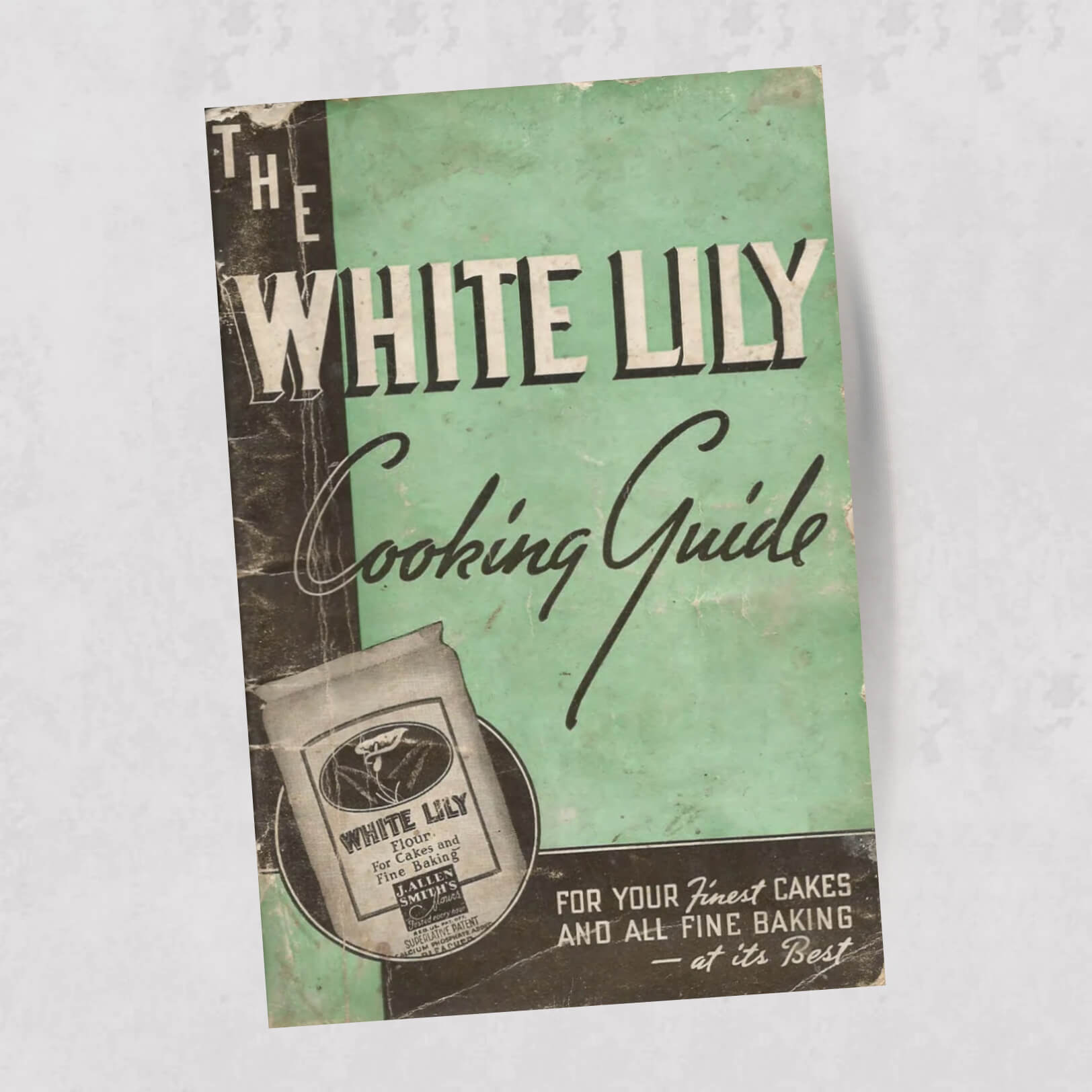 White Lily cookbook next to other White Lily merchandise